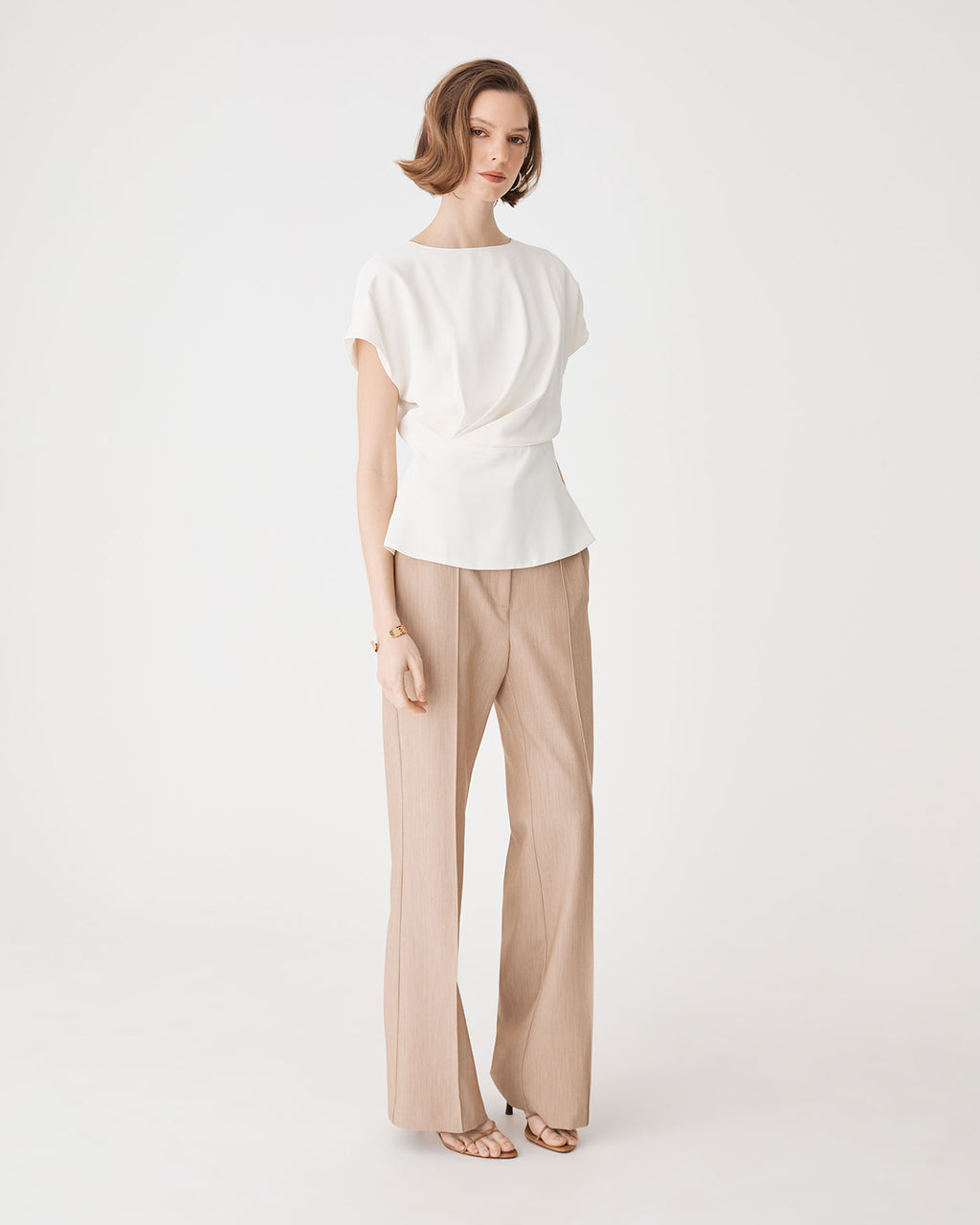 Bonnie Gathered Peplum Top in ivory — side view