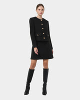 Zahra Boucle Yarn Mini Skirt in black — full-length view