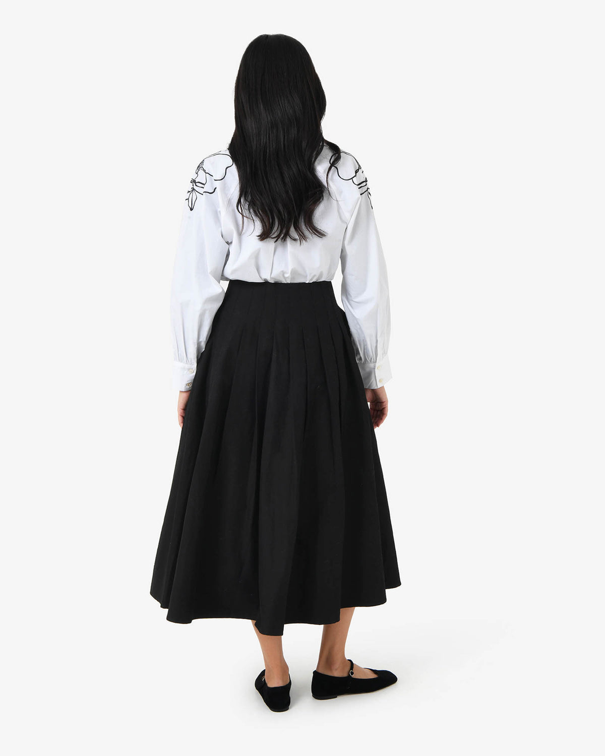 Heira Pleated Midi Skirt in black — back view