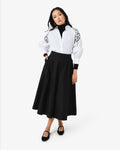 Heira Pleated Midi Skirt in black — full-length view