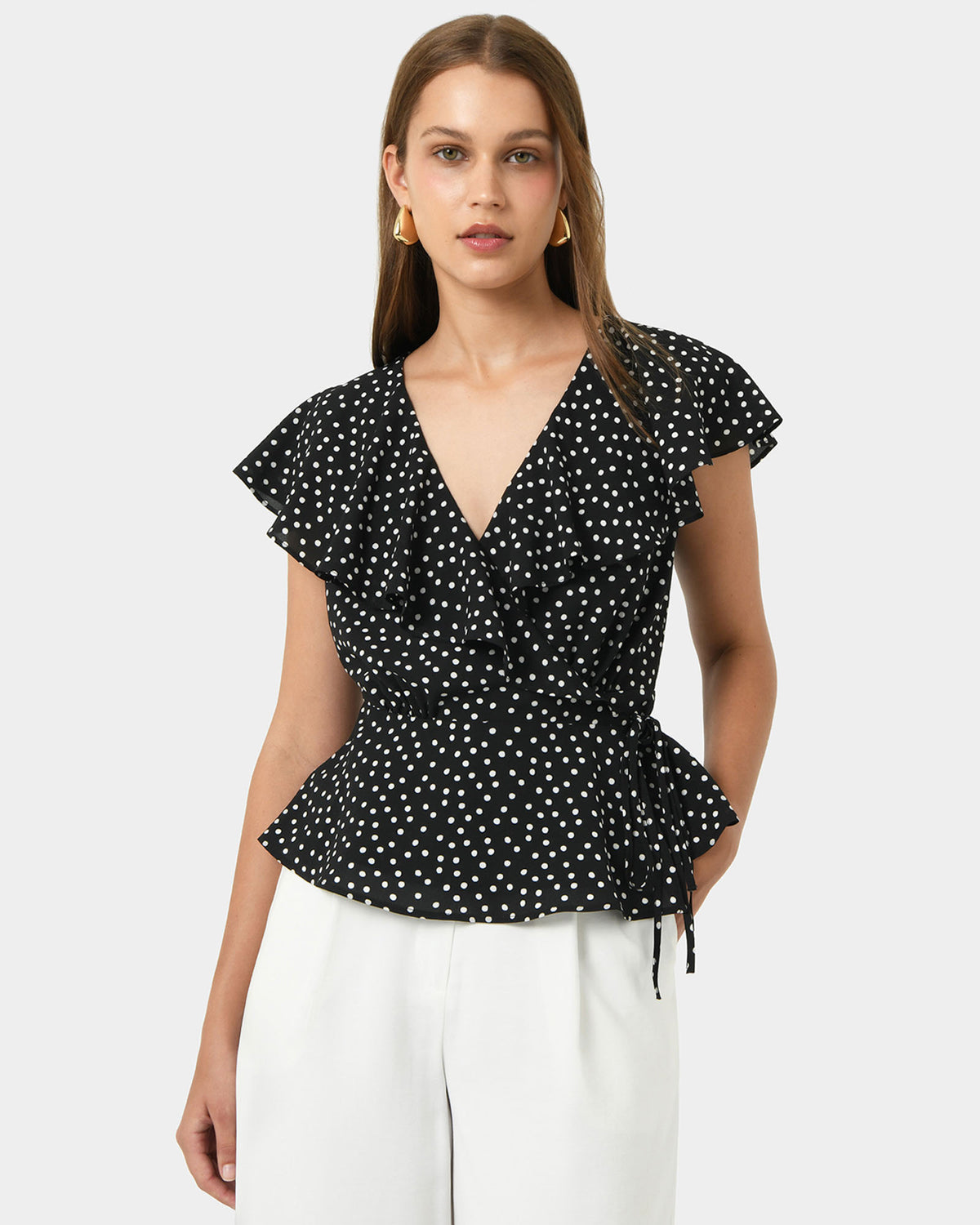 Jules Ruffle Wrap Blouse in polka dot — close-up view