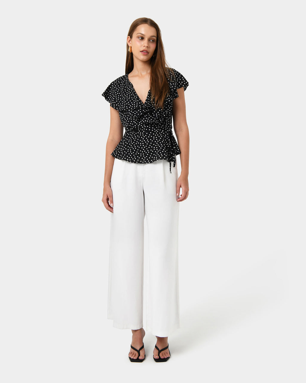 Jules Ruffle Wrap Blouse in polka dot — full-length view