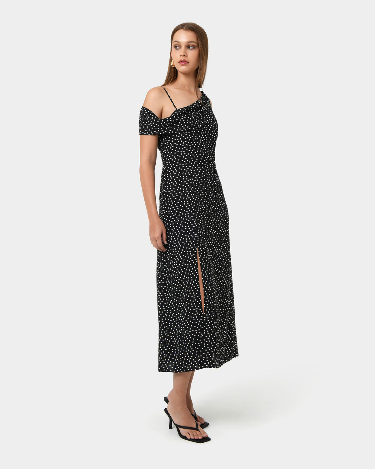 Jules Asymmetric Maxi Dress in polka dot — side view
