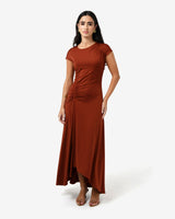Kim Asymmetric Ruched Dress in rust — full-length view
