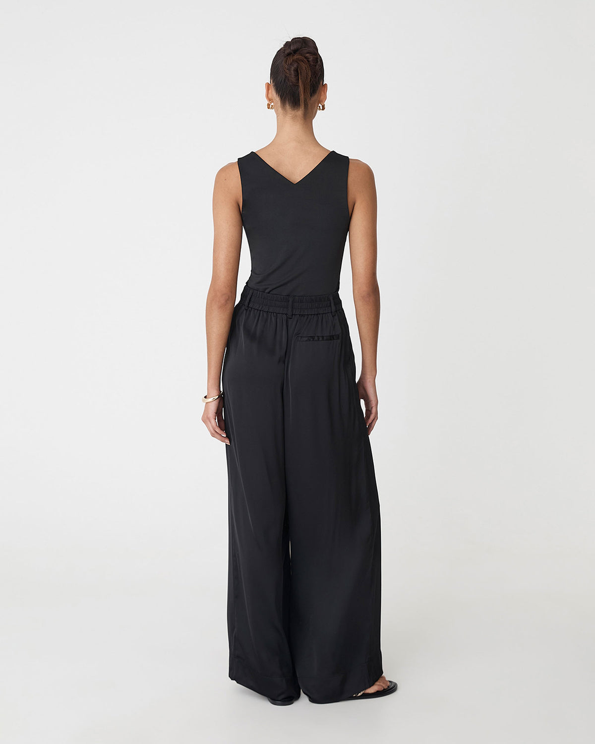 Valeria Wide Leg Satin Pants in black — back view