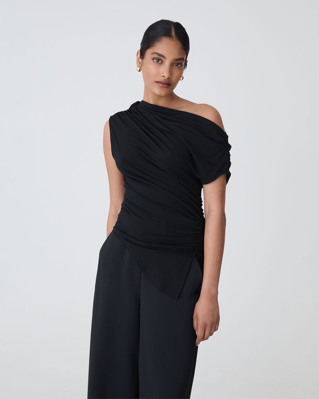 Keeley Bamboo Split Hem Top in black — close-up view
