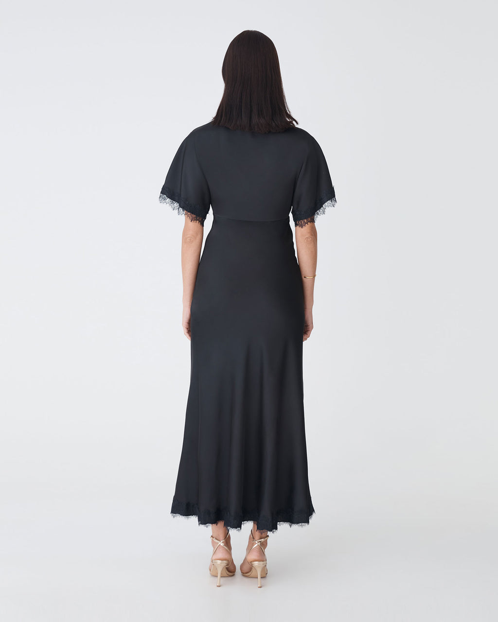 Cleo Lace Trim Satin Dress in black — back view