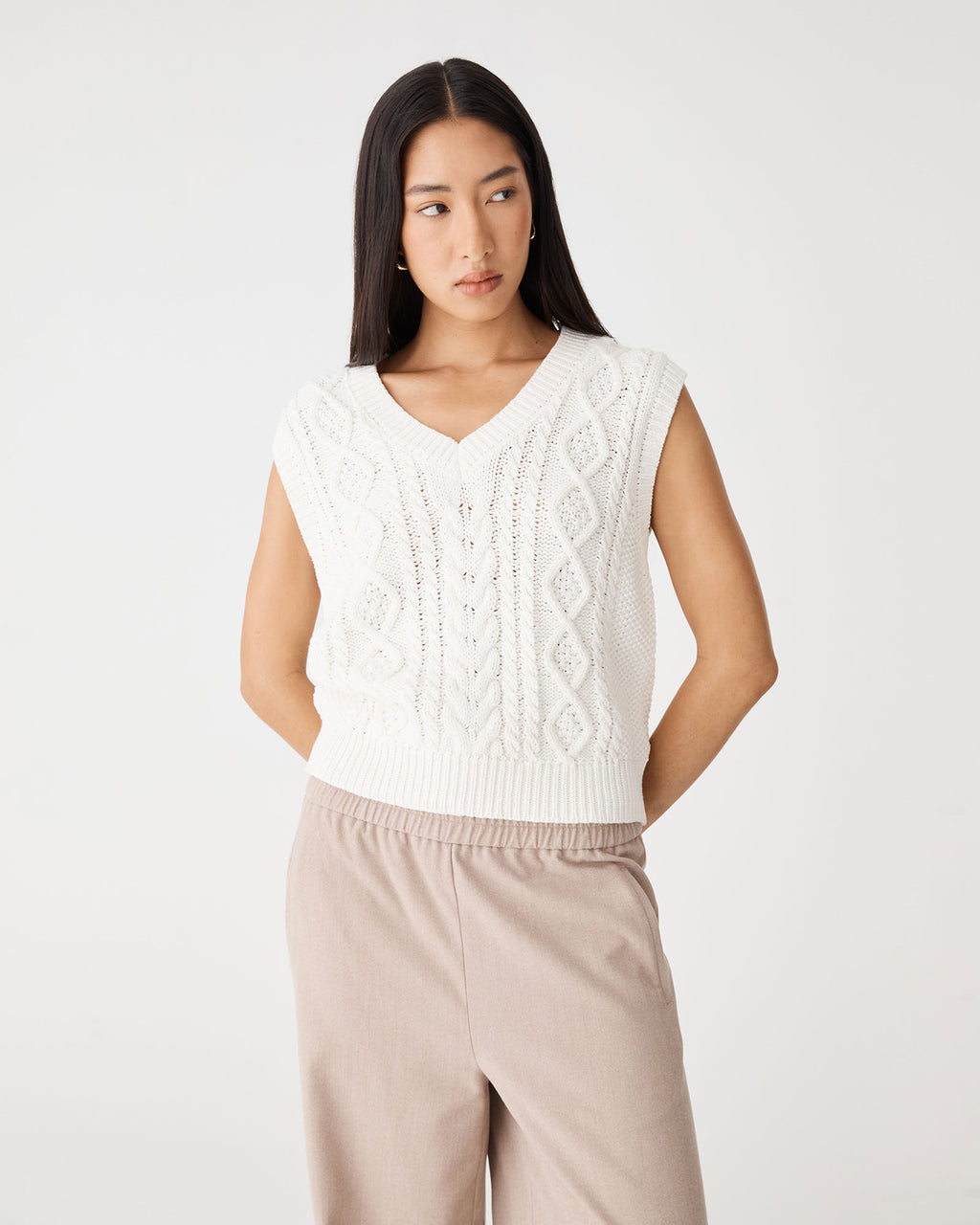 Poppy Sleeveless Cable Knit in ivory — close-up view