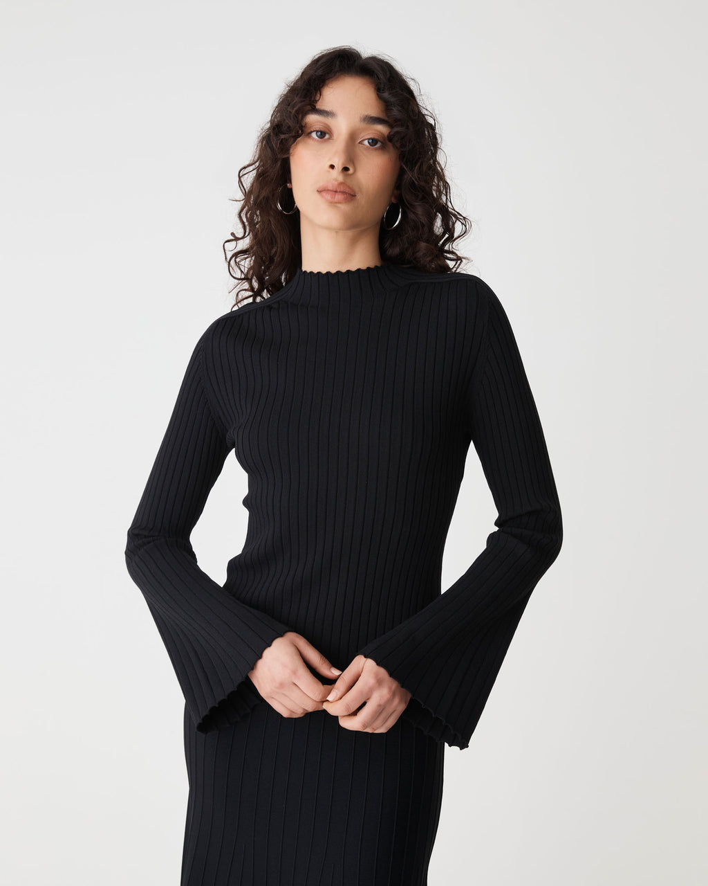 Nevaeh Bell Sleeve Knit in black — close-up view