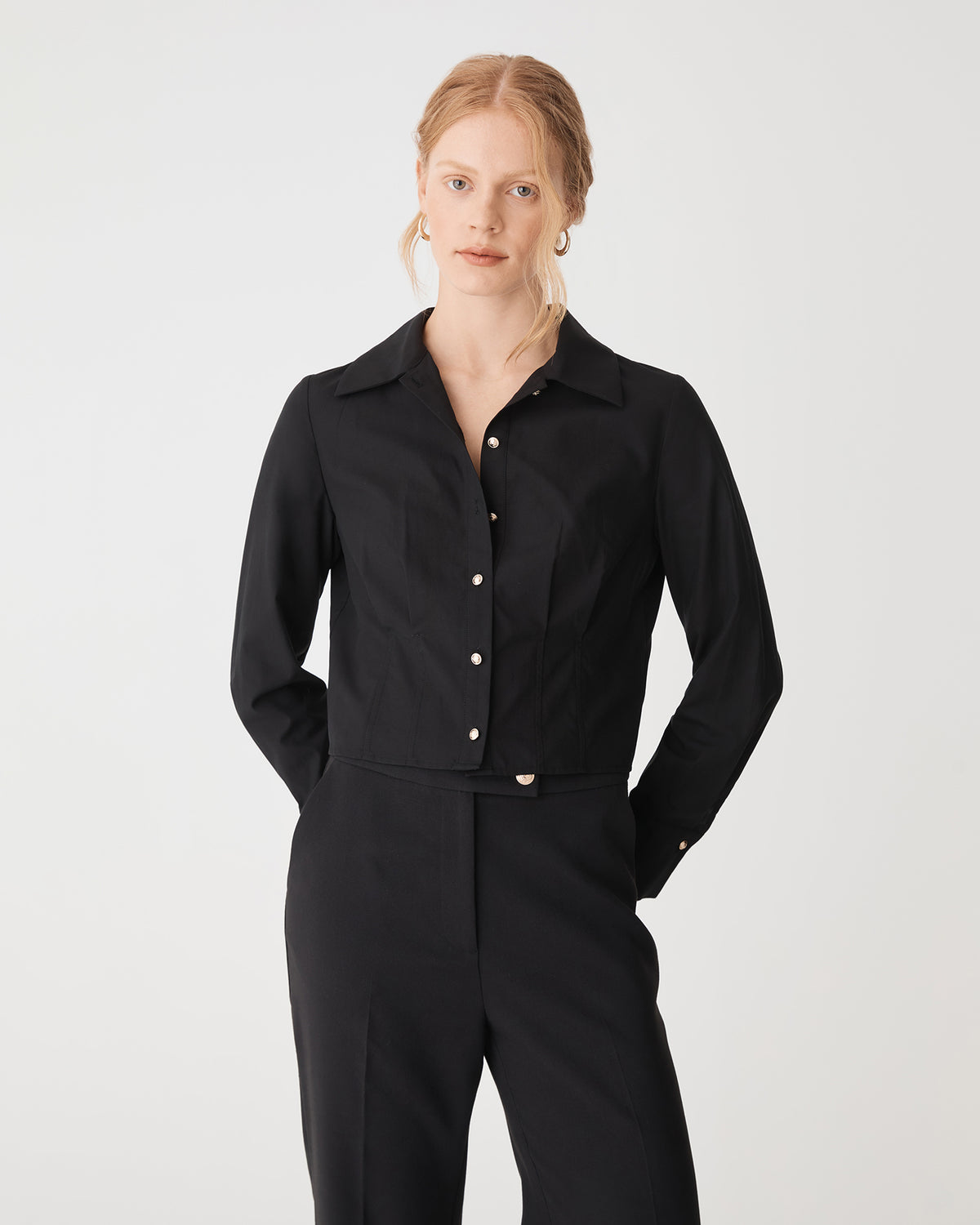Gabby Pleated Hem Shirt in black — close-up view