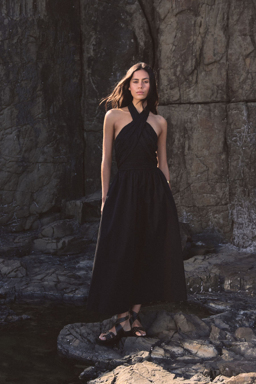 Kayleigh Cotton Halter Dress in black, front view with crossover halterneck and full gathered maxi skirt