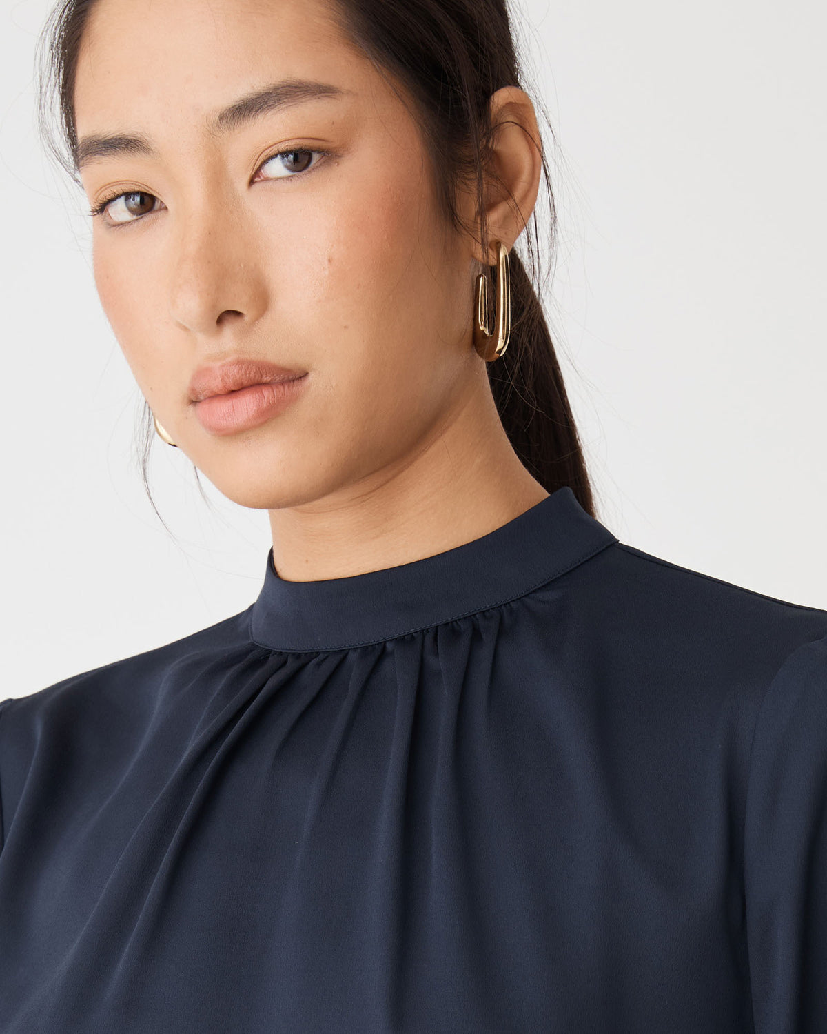 Mila Loop Earrings in gold — fabric detail